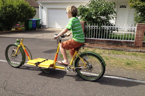 Cargo e-bike carrying a child in a front bucket