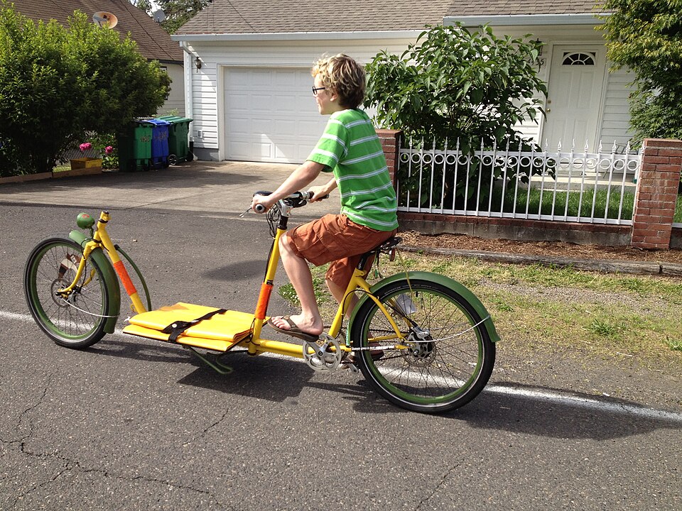Cargo e-bike carrying a child in a front bucket